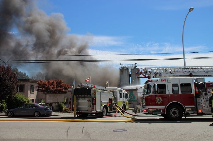 Crews fight a large fire at Mansonville Plastics in Surrey.