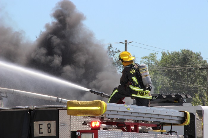 Crews fight a large fire at Mansonville Plastics in Surrey.