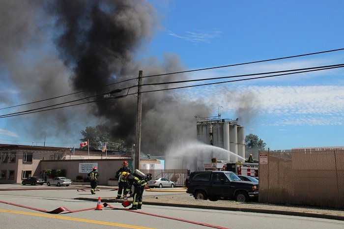 Crews fight a large fire at Mansonville Plastics in Surrey.