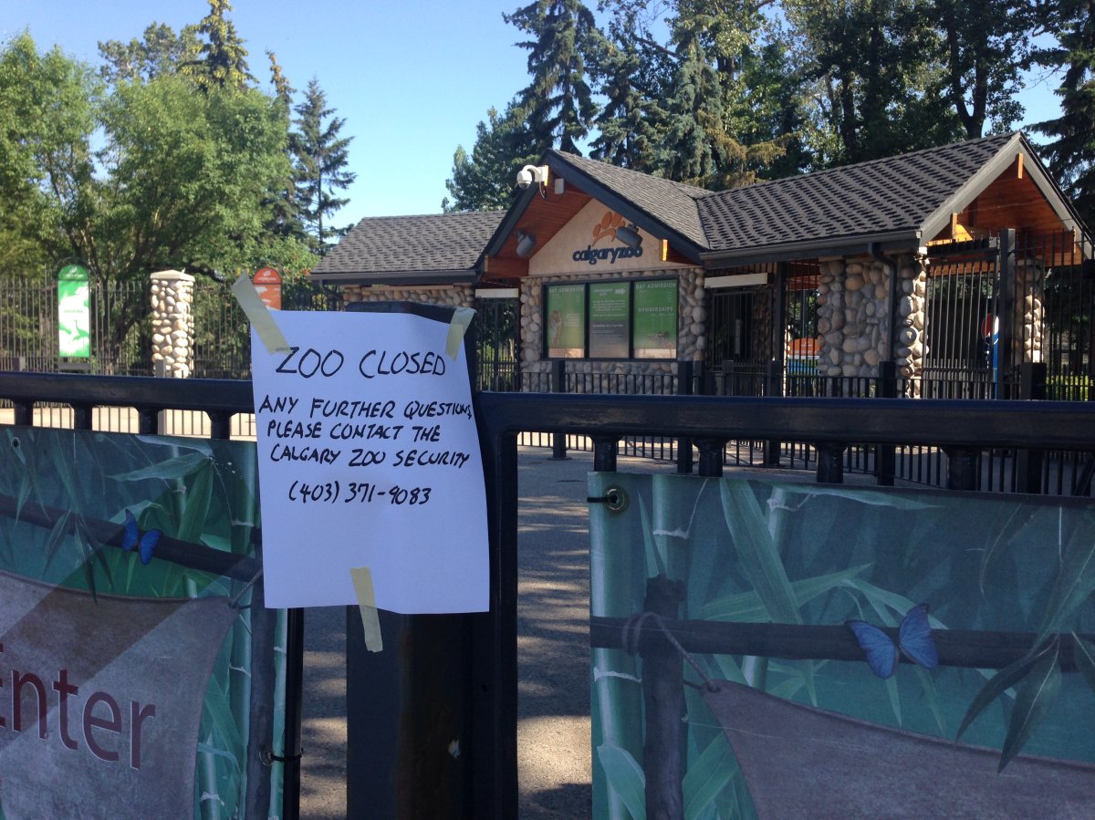 A sign is posted outside the Calgary Zoo notifying visitors of its closure.
