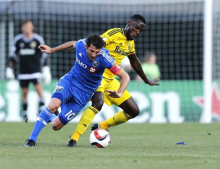 Columbus Crew midfielder Tony Tchani (6) tries to keep the ball from Montreal Impact midfielder Ignacio Piatti (10) during the first half of a soccer match, Saturday, June 6, 2015 in Columbus, Ohio.