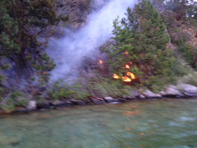Fire burning on the shore of Kalamalka Lake Friday evening. 
