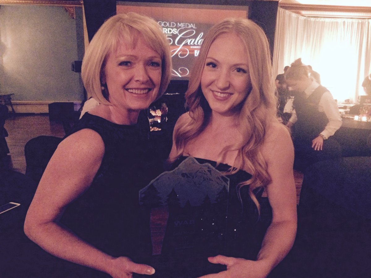 Lesley MacDonald celebrates with her daughter Kayle after accepting the prestigious Gold Medal Award from the Western Association of Broadcasters at a ceremony in Banff, Alberta, on June 4, 2015.