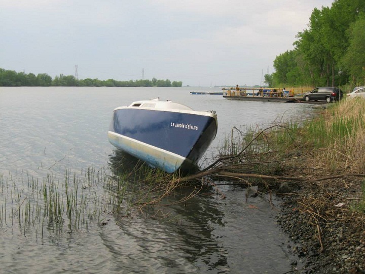 Longueuil police are looking for the owner of a boat found beached along the St. Lawrence River.
