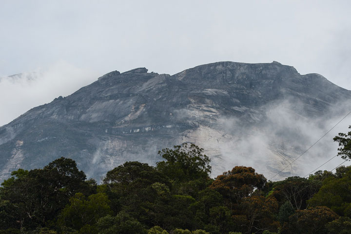 Malaysia's Mount Kinabalu is seen among mists from the Timpohon gate check point a day after the earthquake in Kundasang, a town in the district of Ranau on June 6, 2015.