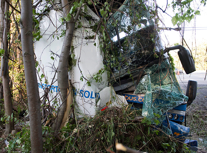 The scene of an accident is shown where dozens were injured, several seriously, when a tractor trailer and double-decker bus en-route from Montreal to Kingston collided on Highway 401 near Cornwall, Ont., on Tuesday, June 23, 2015.