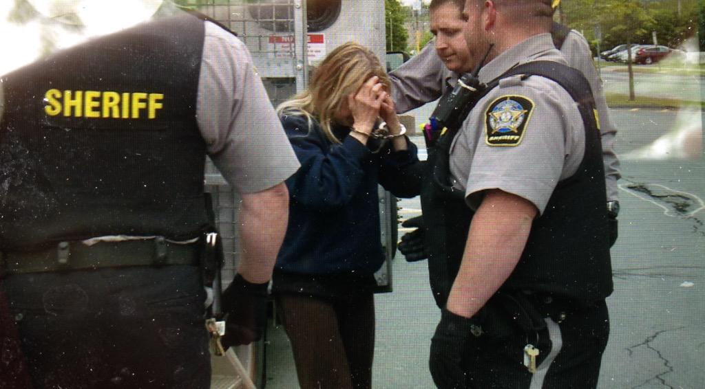Michelle Rhyno is led into Dartmouth Provincial Court. 