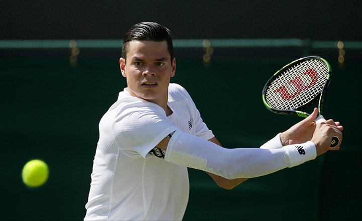 Canada’s Milos Raonic plays a return during the men's singles first round match against Daniel Gimeno-Traver of Spain at the All England Lawn Tennis Championships in Wimbledon, London, Monday June 29, 2015. 