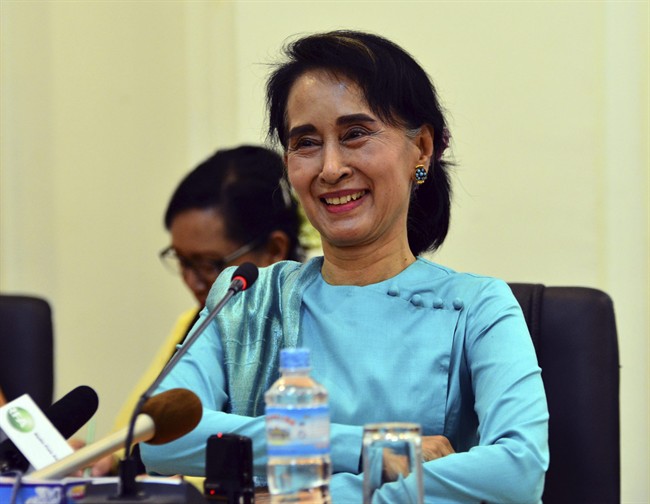 Myanmar's opposition leader Aung San Suu Kyi smiles as she speaks during a press briefing at a parliament building Thursday, June 25, 2015, in Naypyitaw, Myanmar. Myanmar's parliament voted against constitutional amendments Thursday, ensuring that the military's veto power remains intact and that Suu Kyi cannot become president in an election this year. (AP Photo/Aung Shine Oo).