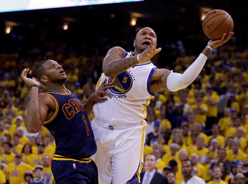 Golden State Warriors forward Marreese Speights (5) shoots against Cleveland Cavaliers forward James Jones (1) during the second half of Game 1 of basketball's NBA Finals in Oakland, Calif., Thursday, June 4, 2015.