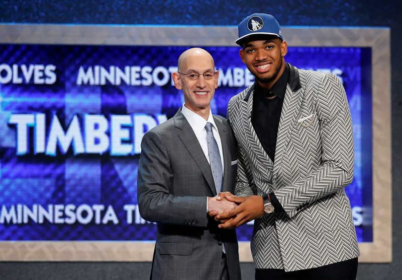 Karl-Anthony Towns, right, poses for a photo with NBA Commissioner Adam Silver after being announced as the top pick during the NBA basketball draft by the Minnesota Timberwolves, Thursday, June 25, 2015, in New York. 
