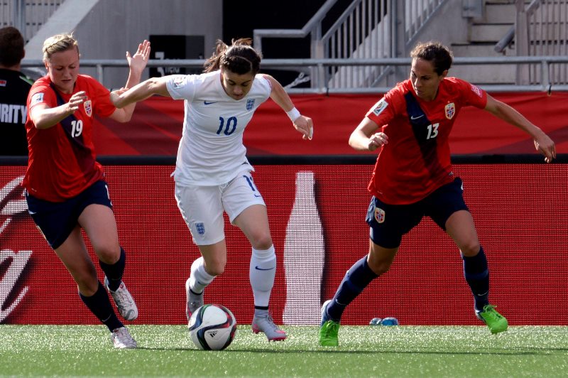 England's Karen Carney (centre) breaks away from Norwegians Kristine Minde (left) and Ingrid Moe Wold (right0 during first half soccer action at the FIFA Women's World Cup round of 16 in Ottawa on Monday, June 22, 2015. 