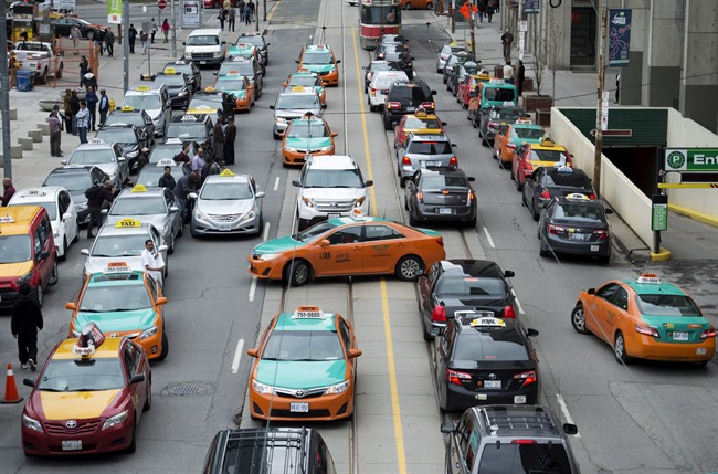 Taxi drivers protest Uber in Toronto on Monday, June 1, 2015. 