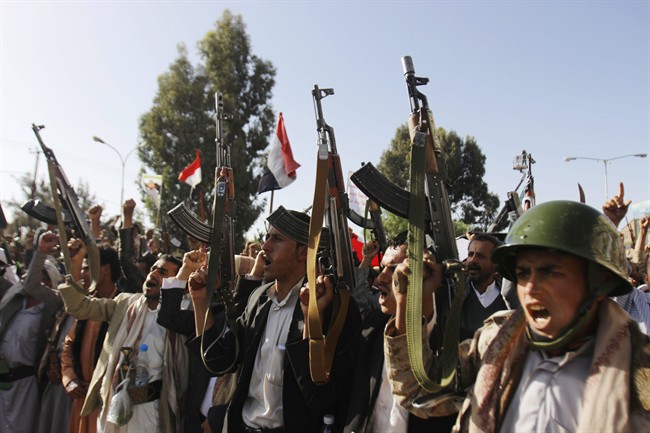 FILE - In this April 16, 2015, file photo, Shiite rebels, known as Houthis, chant slogans during a demonstration against an arms embargo imposed by the U.N. Security Council on Houthi leaders, in Sanaa, Yemen.