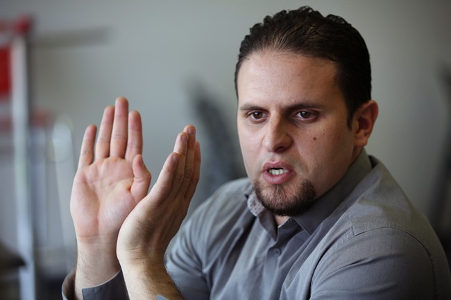 In this May 13, 2015 photo, former Guantanamo detainee and al-Qaida trainee Mourad Benchellali talks during an interview with the Associated Press in Gennevilliers, suburban Paris, France. 