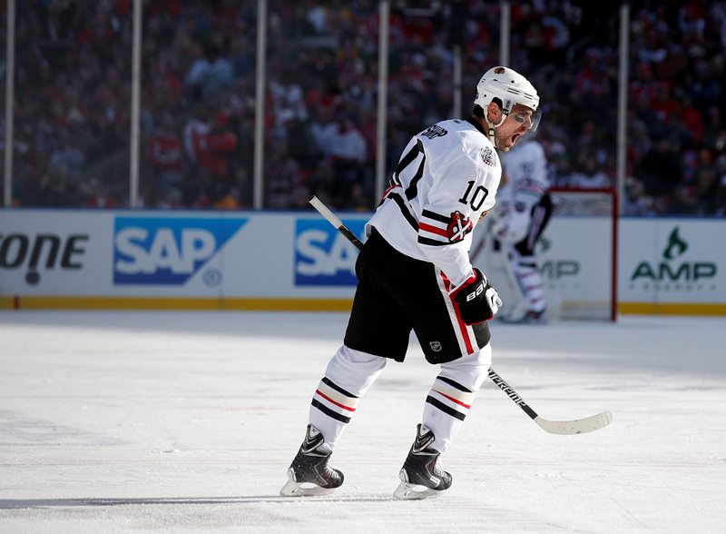 Chicago Blackhawks left wing Patrick Sharp (10) celebrates his goal in the first period of the Winter Classic outdoor NHL hockey game against the Washington Capitals at Nationals Park, Thursday, Jan. 1, 2015, in Washington. 