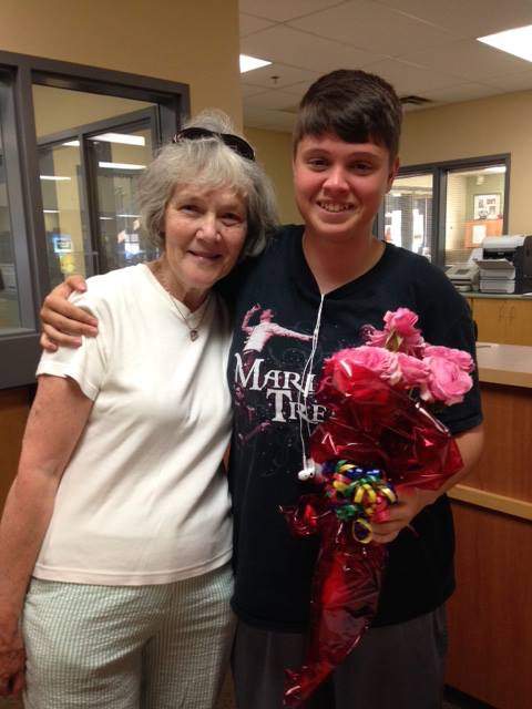 Roberston and Delorme, who is holding the bouquet of roses.