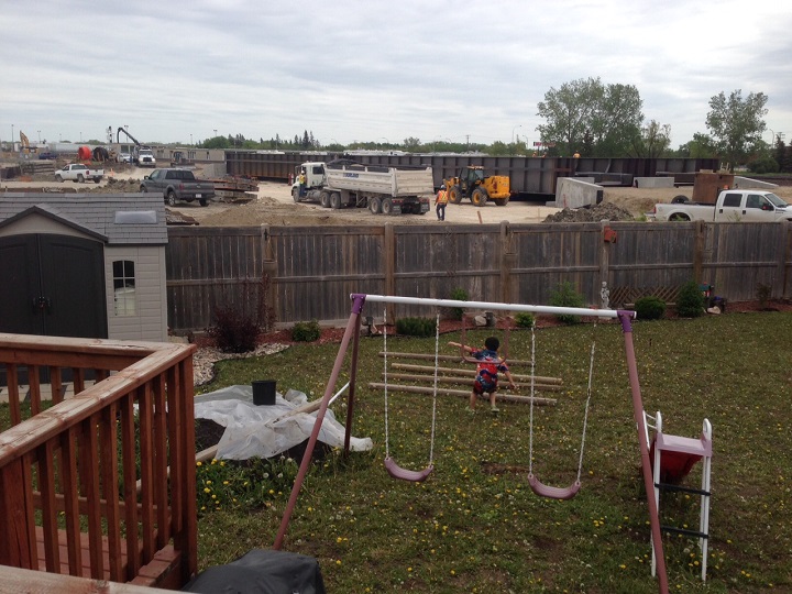A Transcona home overlooks the construction of a new underpass on Plessis Rd on Monday, June 1, 2015.