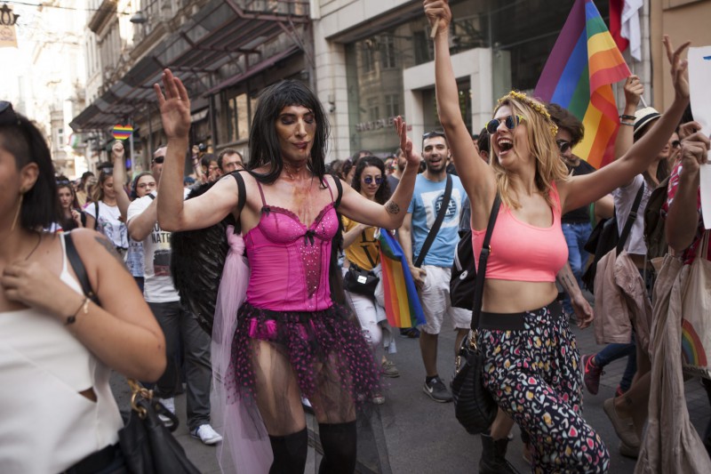 Gay pride supporters wave flags before Istanbul police used water cannons, rubber bullets as well as tear gas on pride paraders in Turkey's 13th annual gay parade.