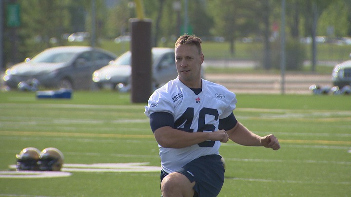 Chad Rempel stretches in between drills during training camp with the Bombers in 2015.