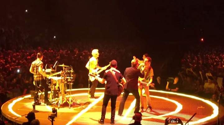 Ryan Luxenberg, 23, sings 'Desire' live with U2 at the Bell Centre.