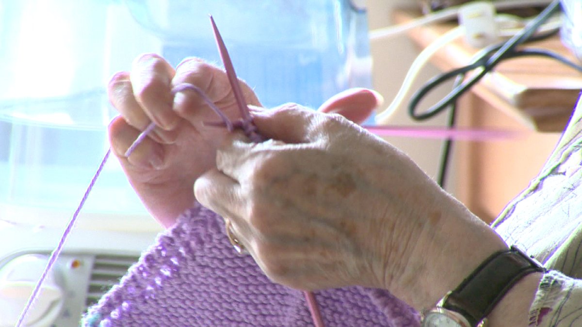 A file photo of a senior knitting.