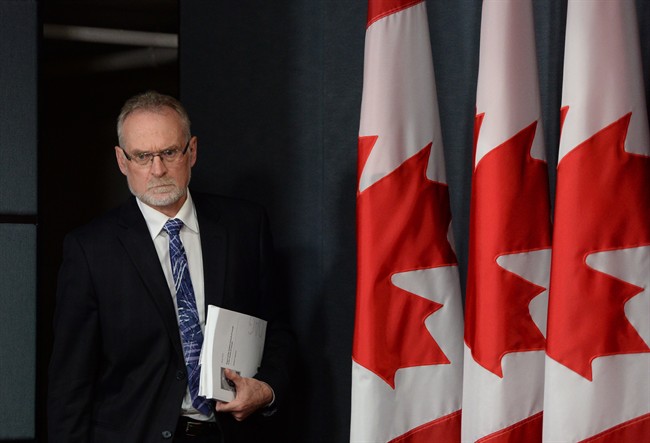 Auditor General Michael Ferguson arrives at a news conference at the National Press Theatre in Ottawa on Tuesday, June 9, 2015 to discuss the Report on Senators' Expenses.