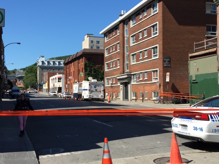 Police investigate a bar brawl that resulted in one death on Saint-Laurent street in Montreal, Wednesday, June 24, 2015.