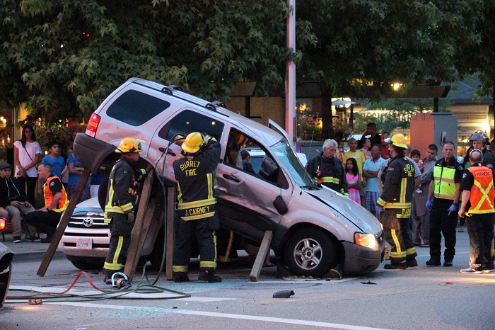 An SUV lands on top of another in Surrey crash - image