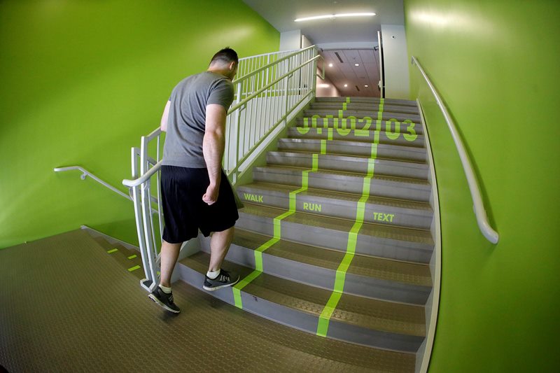 In this file photo a Utah Valley University student walks up the stairs to the gym.