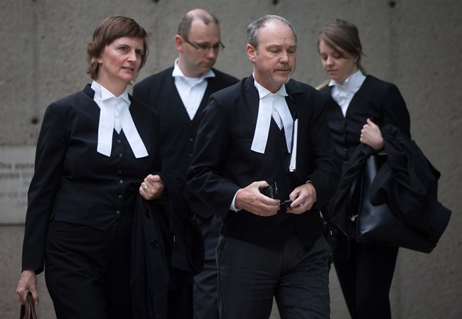 John Nuttall's lawyer Marilyn Sanford, left, and Amanda Korody's lawyer Mark Jette, third left, leave B.C. Supreme Court in Vancouver, B.C., on Tuesday June 2, 2015.