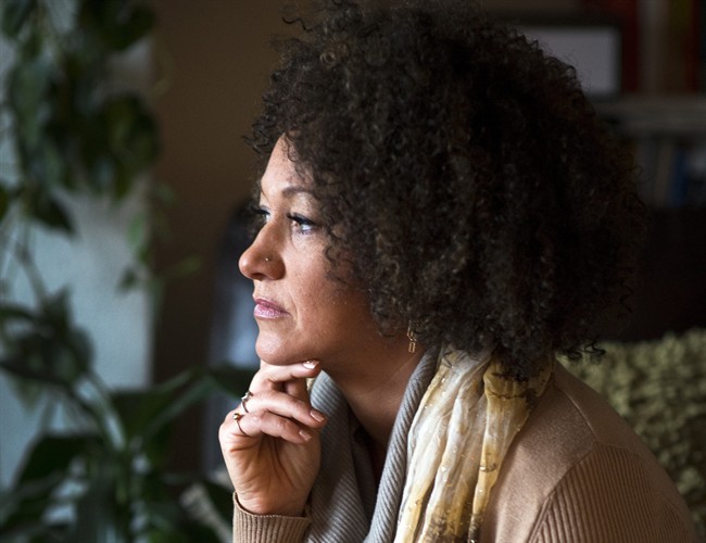 In this March 2, 2015 file photo, Rachel Dolezal, president of the Spokane chapter of the NAACP, poses for a photo in her Spokane, Wash. home. 