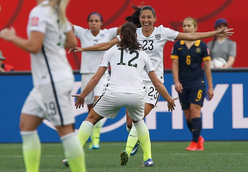 USA's Christen Press (23) celebrates her goal against Australia with Lauren Holiday (12) during FIFA Women's World Cup second half soccer action in Winnipeg on Monday, June 8, 2015. 