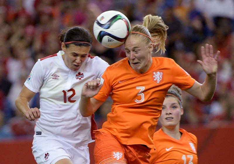 Canada's Christine Sinclair (12) and Netherlands' Stefanie Van Der Gragt (3)battle for the ball during second half FIFA Women's World Cup soccer in Montreal on Monday, June 15, 2015. 