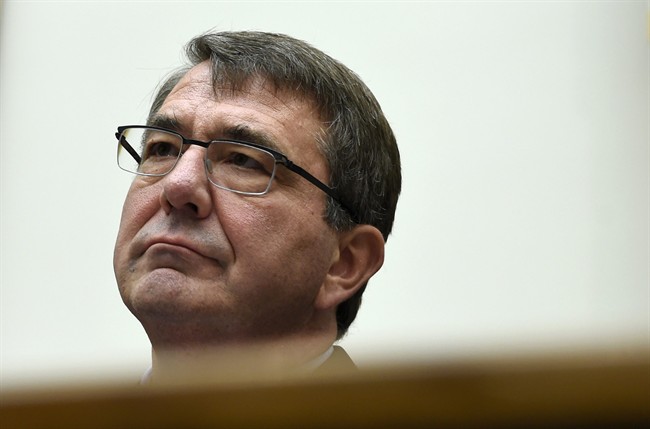 FILE - In this June 17, 2015 file photo, Defense Secretary Ash Carter waits to testify on Capitol Hill in Washington. 