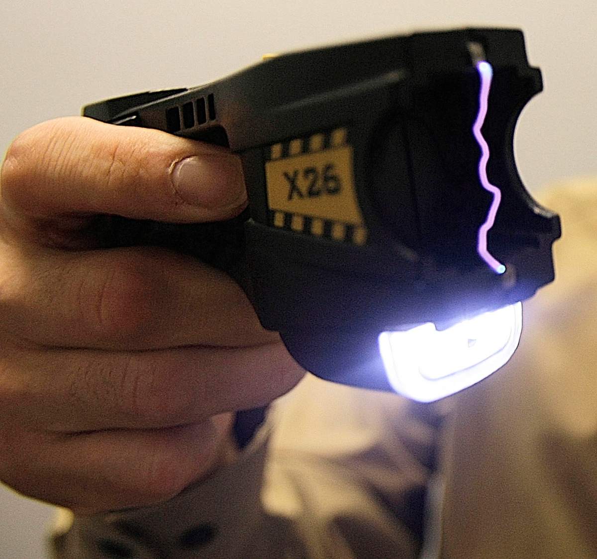 FILE-In this Aug. 16, 2007, file photo, Police Chief John Martin demonstrates a Taser in Brattleboro, Vt.