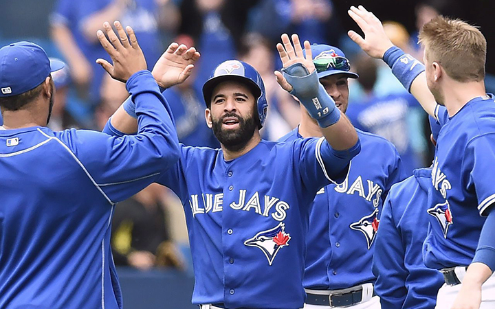 Toronto Blue Jays' Jose Bautista celebrates with teammates after scoring on a two-run walk-off single in the ninth inning of MLB action against the Houston Astros on Sunday, June 7, 2015.