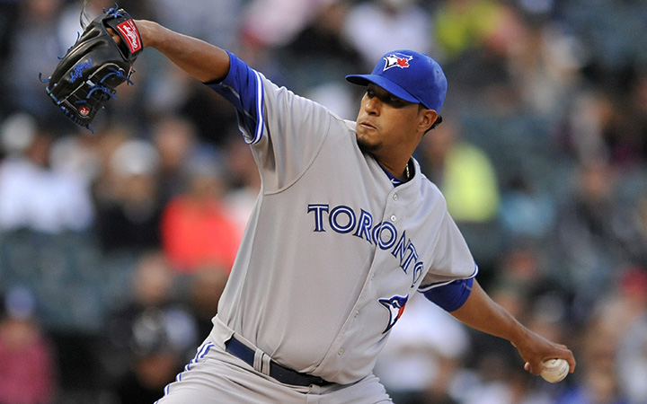 Toronto Blue Jays starter Felix Doubront delivers a pitch during the first inning of a baseball game against the Chicago White Sox Tuesday, July 7, 2015, in Chicago.