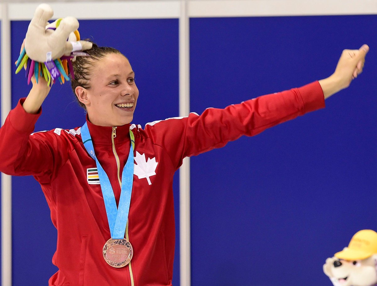 Rachel Nicol of Canada poses with her bronze medal in the women's 100m breaststroke final swimming event at the 2015 Pan Am Games in Toronto on Friday, July 17, 2015. 