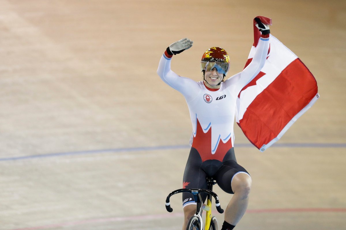 Canada's Monique Sullivan celebrates after winning the women's keirin track cycling competition at the Pan Am Games in Milton, Ontario, Friday, July 17, 2015. Sullivan won the gold medal.