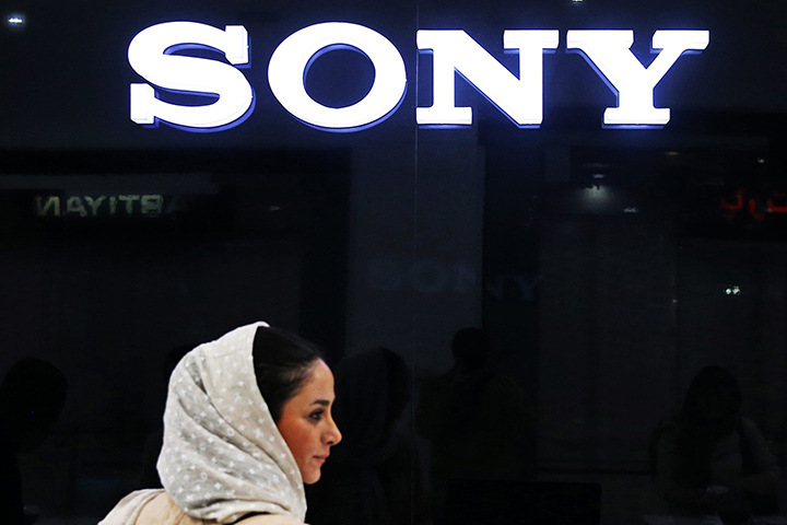An Iranian woman walks past a Sony dealer at a shopping center in downtown Tehran, Iran on  Friday, July 17, 2015. While it will likely be months before sanctions on Iran ease, business and political leaders are wasting no time in trying to tap into a large and what they hope will be a lucrative Iranian market.