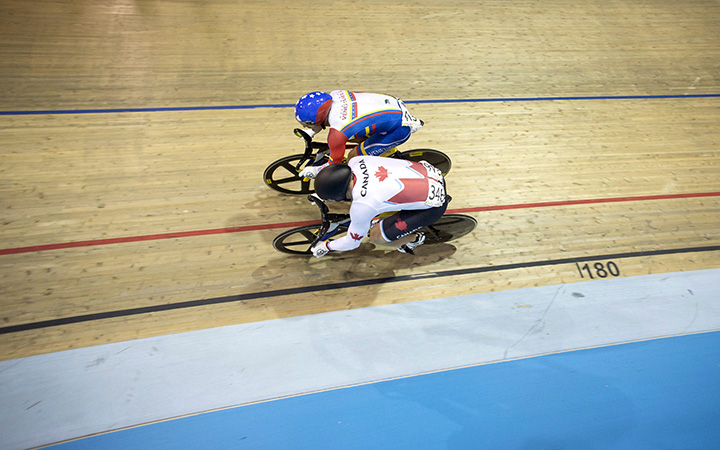 Canada's Hugo Barrette competes against Venezuela's Hersony Canelon Vera during the men's sprint semifinals at the Pan Am games in Milton, Ont., on Saturday, July 18, 2015. Barrette would go on to win the gold medal race.