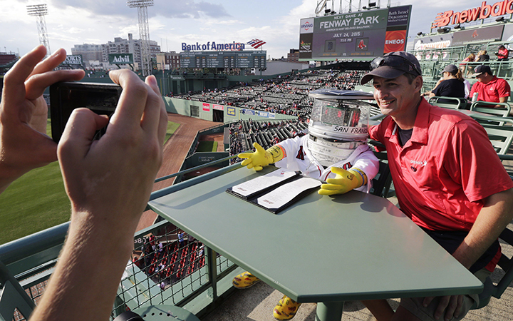 HitchBOT posing for photos before a baseball game at Fenway Park between the Boston Red Sox and the Detroit Tigers on Friday, July 24, 2015, in Boston.