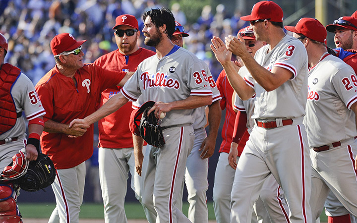 Philadelphia Phillies starting pitcher Cole Hamels, center, is congratulated by teammates after he pitched a no-hitter against the Chicago Cubs, during a baseball game in Chicago on Saturday, July 25, 2015. The Phiillies won 5-0.