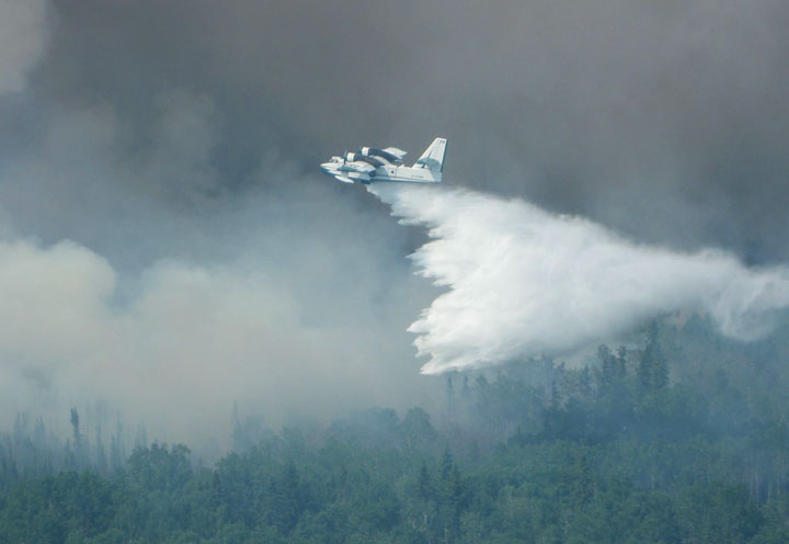 Little rain in Saskatchewan, officials warn wildfire evacuees against heading home.