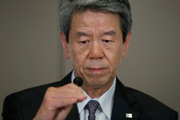 Hisao Tanaka, president and chief executive officer of Toshiba Corp., adjusts a microphone while addressing a news conference at the company's headquarters in Tokyo, Japan, on Friday, May 15, 2015.