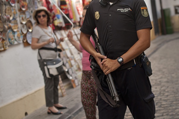 A member of the Spanish special police unit patrols near the Mezquita, the Mosque-Cathedral of Cordoba on July 7, 2015.