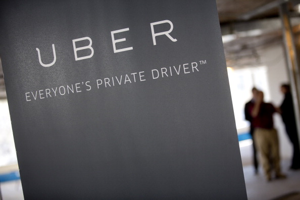 Uber Technologies Inc. signage stands inside the company's office prior to Senator Marco Rubio, a Republican from Florida, speaking in Washington, D.C., U.S., on Monday, March 24, 2014.
