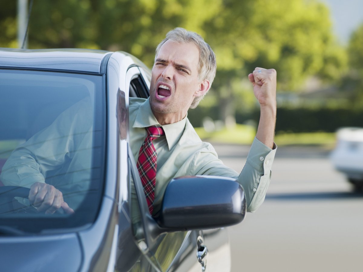 FILE: An angry driver shouting out of a car window.