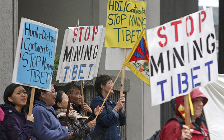 A group of people demonstrate against mining in Tibet outside Continental Minerals' annual shareholders meeting in Vancouver, B.C., on June 24, 2009. The UN Human Rights Committee in Geneva is looking for answers in how Canadian mining and resource companies deal with
complaints of abuse.